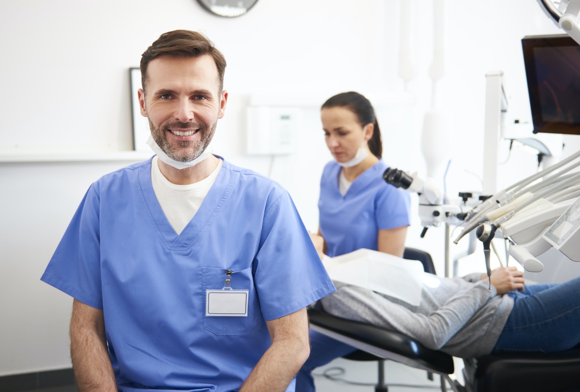portrait-of-smiling-male-dentist-in-dentist-s-clinic.jpg
